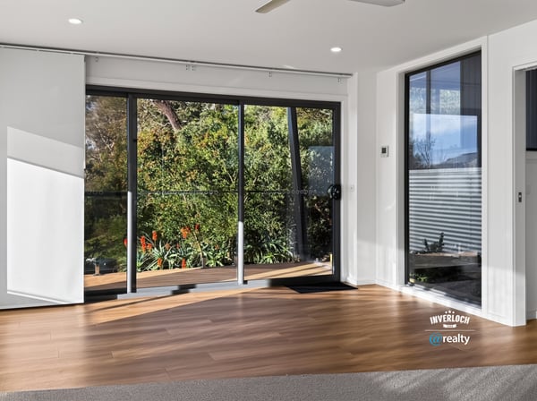 Bright and airy living space with large windows that offer stunning views of the outdoors.