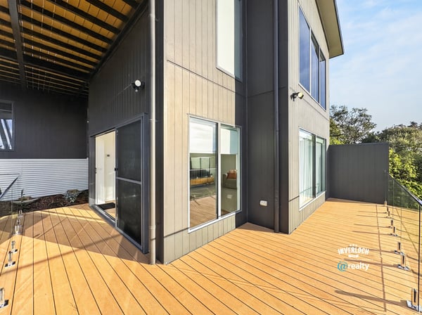 Contemporary design meets outdoor space in this inviting home with expansive decking and bright living areas.