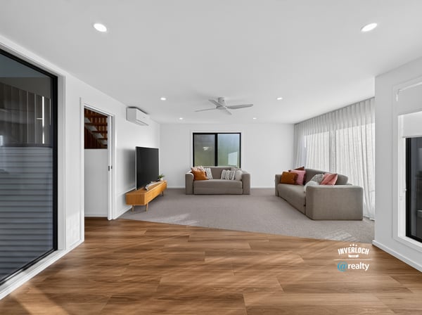 Spacious living area featuring modern finishes and ample natural light, perfect for relaxed entertaining.