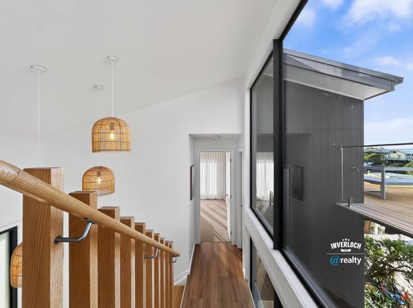 Modern open-concept design featuring natural light and unique pendant lighting, ideal for contemporary living.