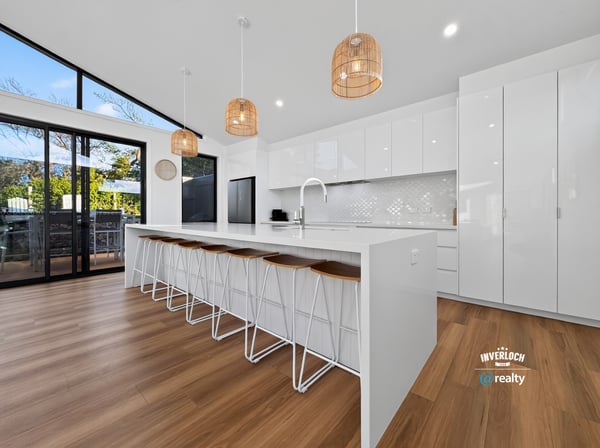 Modern kitchen featuring spacious design, sleek cabinetry, and ample natural light, perfect for entertaining.