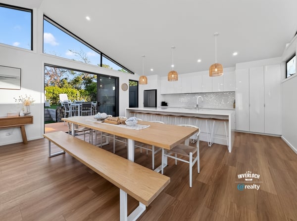 Bright and spacious kitchen features modern amenities, abundant natural light, and an inviting dining area.