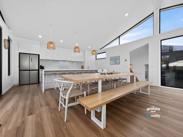 Spacious kitchen and dining area featuring modern appliances, ample natural light, and a generous layout.
