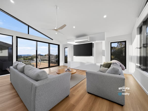 Bright and airy living space featuring large windows that showcase stunning outdoor views and modern design.
