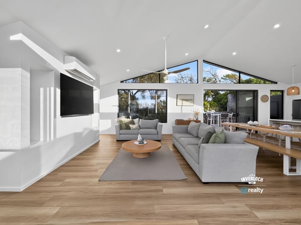 Bright and airy living space with large windows offering stunning views and seamless indoor-outdoor flow.