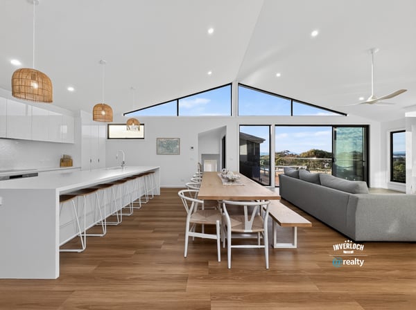 Spacious open-concept living area with modern finishes and abundant natural light, perfect for entertaining.