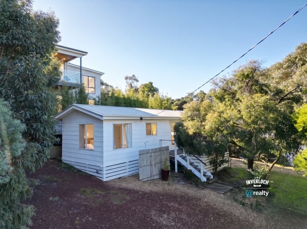 Cozy retreat nestled among lush greenery, offering a peaceful atmosphere and comfortable living space.