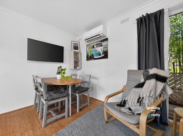 Bright and airy living space featuring a cozy dining area and modern amenities for comfortable living.
