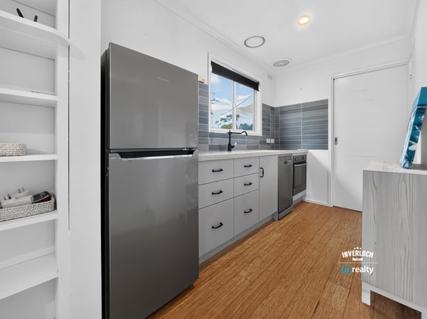 Modern kitchen featuring sleek appliances, ample storage, and a bright, inviting atmosphere perfect for cooking.