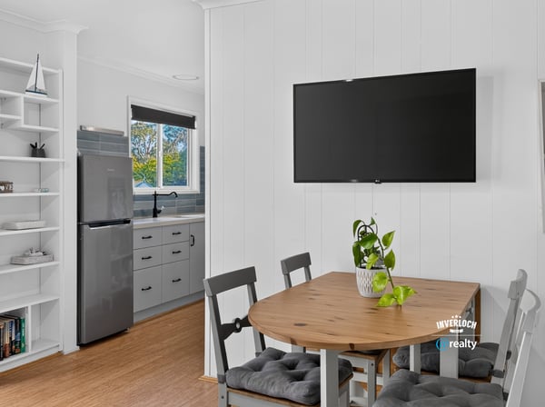 Bright open kitchen and dining area with modern appliances and inviting natural light for casual gatherings.