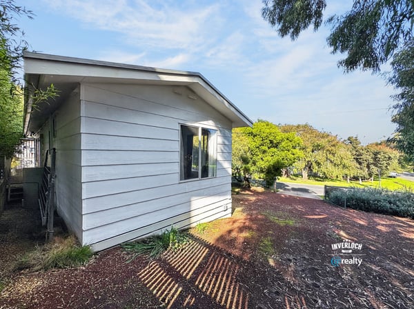 This contemporary home features a distinct design and abundant natural light in a peaceful neighborhood.
