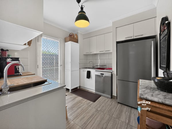 Modern kitchen featuring sleek appliances, ample storage, and natural light, perfect for culinary enthusiasts.