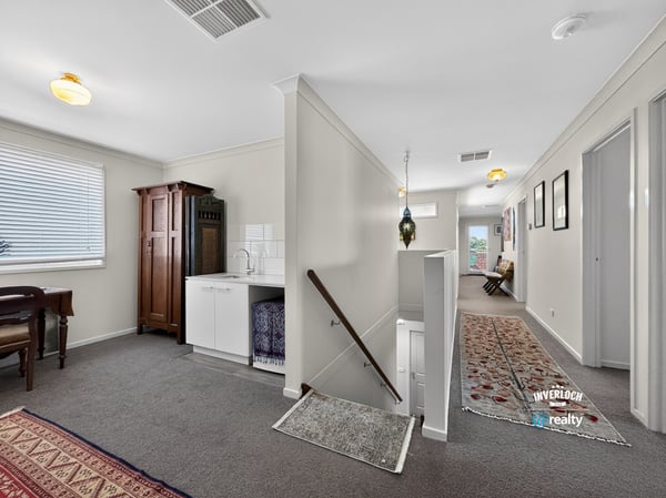 Spacious, well-lit entryway featuring a unique blend of modern convenience and classic design elements.