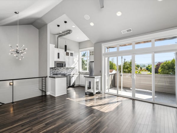 Wall of windows and large sliding glass door to the deck.