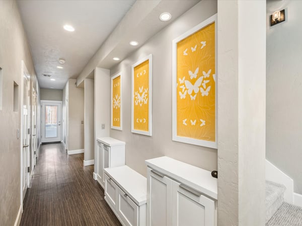 Main level entry hall with built-in shelving.
