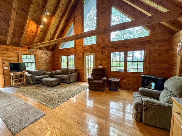 Vaulted Beamed Ceiling. Wall of Windows. Hardwood Floors