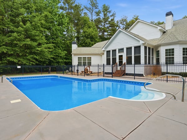This luxury home features a spacious backyard with a refreshing salt water pool, perfect for relaxation and entertaining.