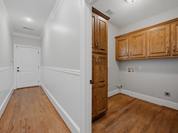 Laundry room on the main level with plenty of storage