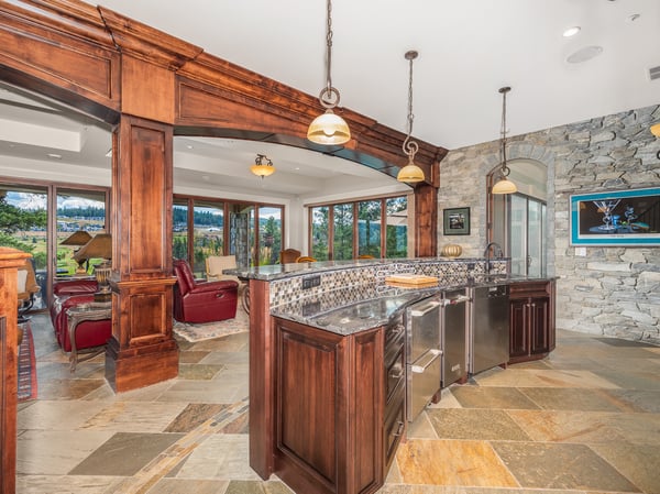 Discover a beautifully designed full bar/kitchen that seamlessly blends luxury with breathtaking views, natural light, and functionality.