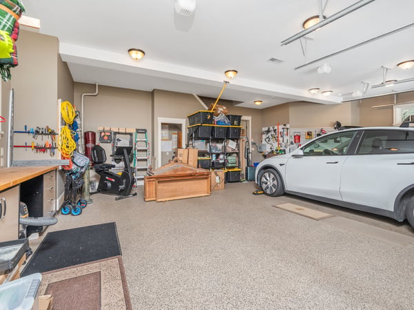 Spacious garage with ample storage, versatile workspaces, and room for multiple vehicles and projects.