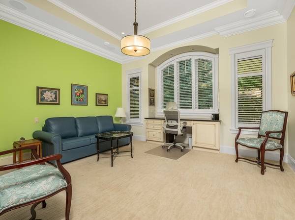 Main floor ensuite bedroom facing the street. The green wall has been painted white.