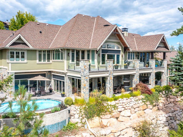 Spacious multi-level home features stunning outdoor spaces, a pool, and beautiful landscaping, perfect for entertaining.