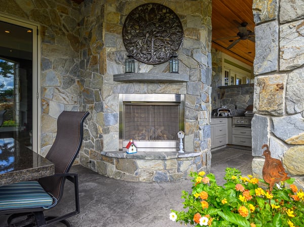 Discover a unique outdoor space featuring a stone fireplace, perfect for gatherings and relaxation.