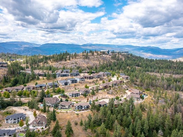 Breathtaking hillside community boasting stunning panoramic views and a blend of natural beauty and modern homes.