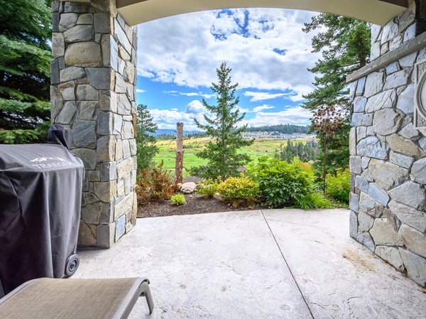 Enjoy stunning views of the landscape from this inviting outdoor space, perfect for relaxation or entertaining.