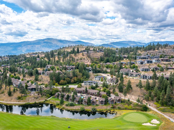 Discover this scenic property with stunning views of lush landscapes and a vibrant golf course.
