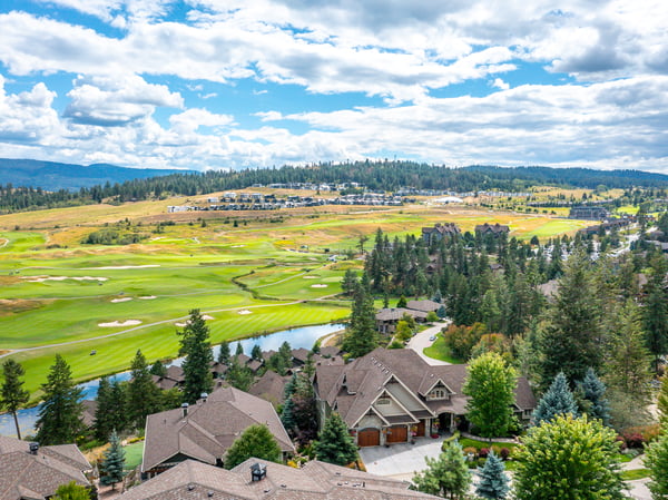Discover this stunning hillside home with breathtaking views of lush golf greens and picturesque landscapes.