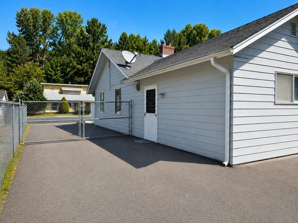 This well-maintained property features a secure yard, newer roof and exterior paint.