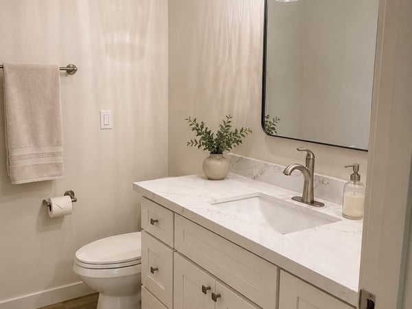 Main bathroom boasts a sleek vanity and contemporary fixtures.