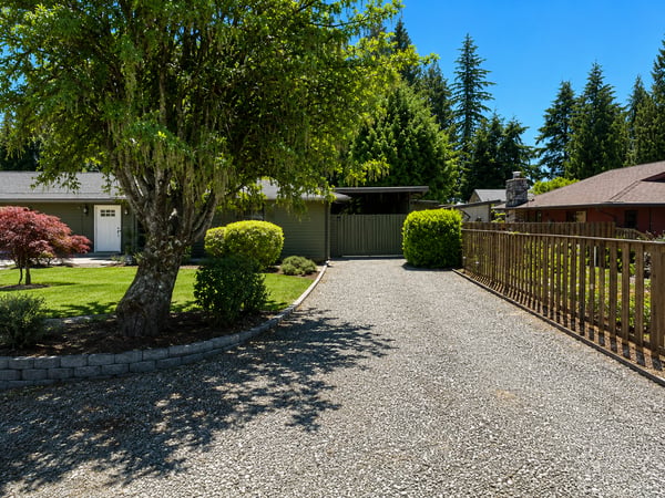 A view of the 2nd spacious driveway that leads to the carport with tons of storage.