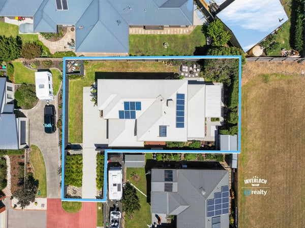 Spacious property featuring modern architecture, ample yard space, and energy-efficient solar panels, perfect for families.