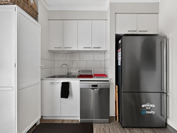 Modern kitchen equipped with stainless steel appliances and efficient design for seamless meal preparation.