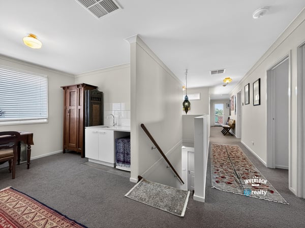 Spacious, well-lit entryway featuring a unique blend of modern convenience and classic design elements.