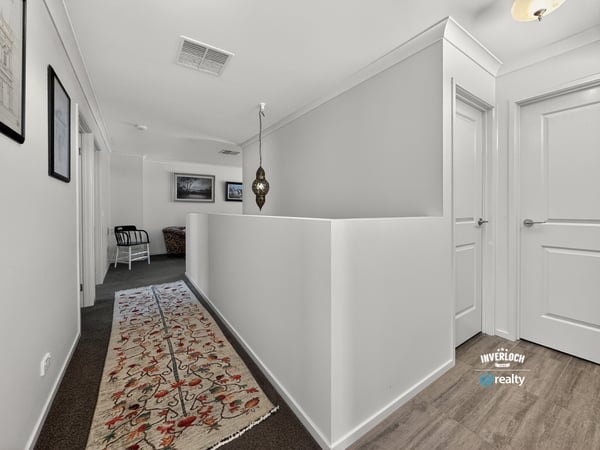 Bright and spacious hallway featuring modern decor and a welcoming atmosphere, perfect for any home.