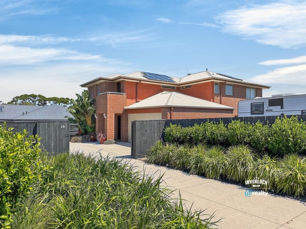 This spacious two-story home features modern amenities, ample parking, and well-maintained landscaping in a prime location.