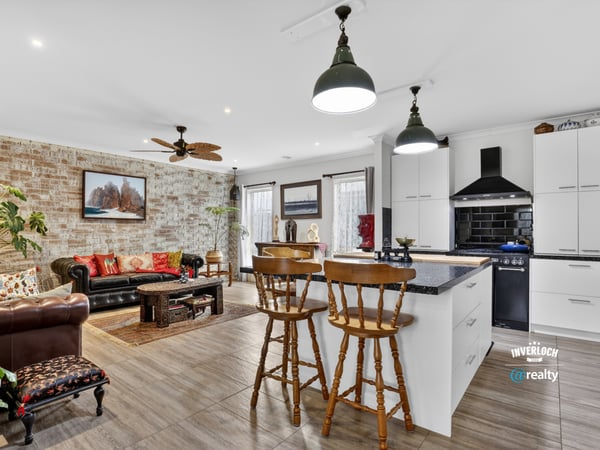 Bright and inviting open-concept living space featuring modern amenities and a cozy atmosphere.