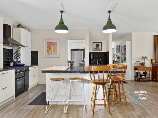 Modern kitchen with a spacious island, perfect for entertaining and everyday functionality, awaits your culinary creativity.
