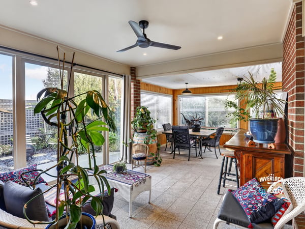 Bright and spacious sunroom featuring ample natural light, perfect for relaxing and entertaining.
