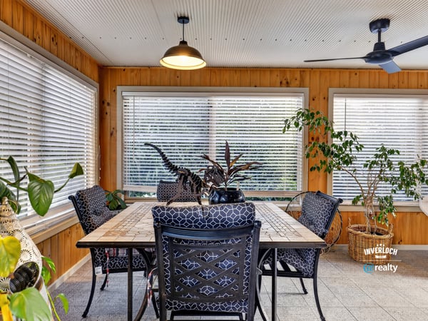 Bright and airy sunroom featuring ample natural light, perfect for relaxation or casual dining.