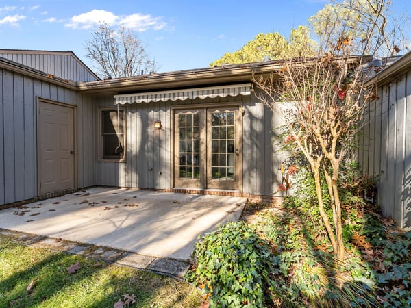 Rear patio with retractable awning and storage closet