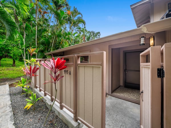 Discover a tranquil retreat featuring lush landscaping and a welcoming entrance, perfect for relaxed living.