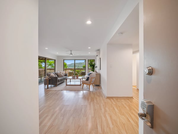 Spacious living area with natural light, seamlessly connecting to outdoor views and a relaxing atmosphere.