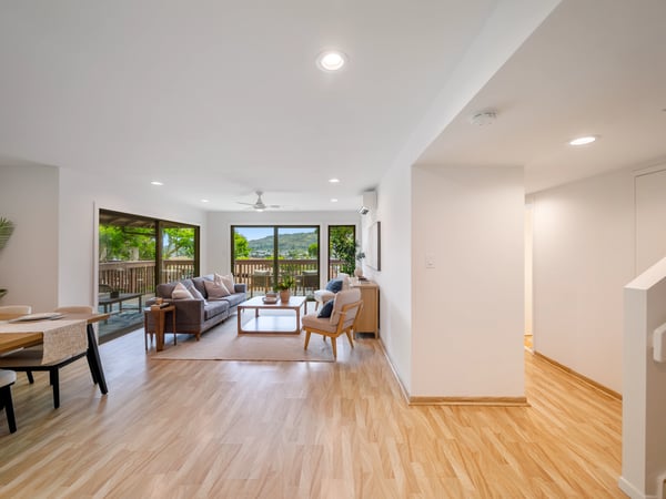 Spacious living area with natural light, panoramic views, and seamless indoor-outdoor flow ideal for entertaining.