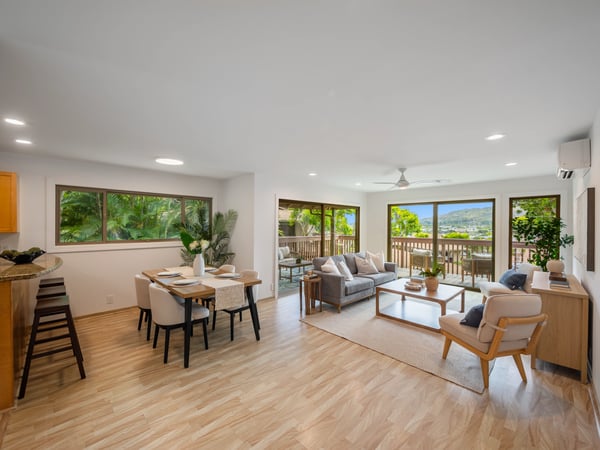 Bright and airy living space with panoramic views, seamless indoor-outdoor flow, and modern furnishings.