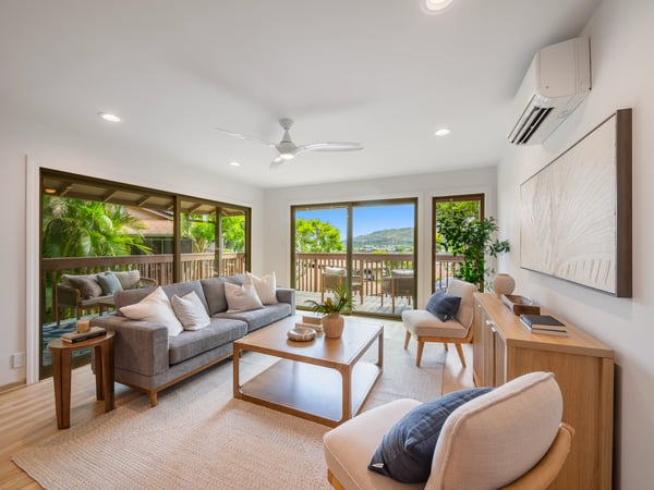 Bright and airy living space featuring panoramic views, modern furnishings, and seamless indoor-outdoor flow.