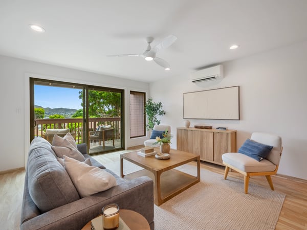 Bright and airy living room featuring modern decor and a seamless connection to outdoor views.
